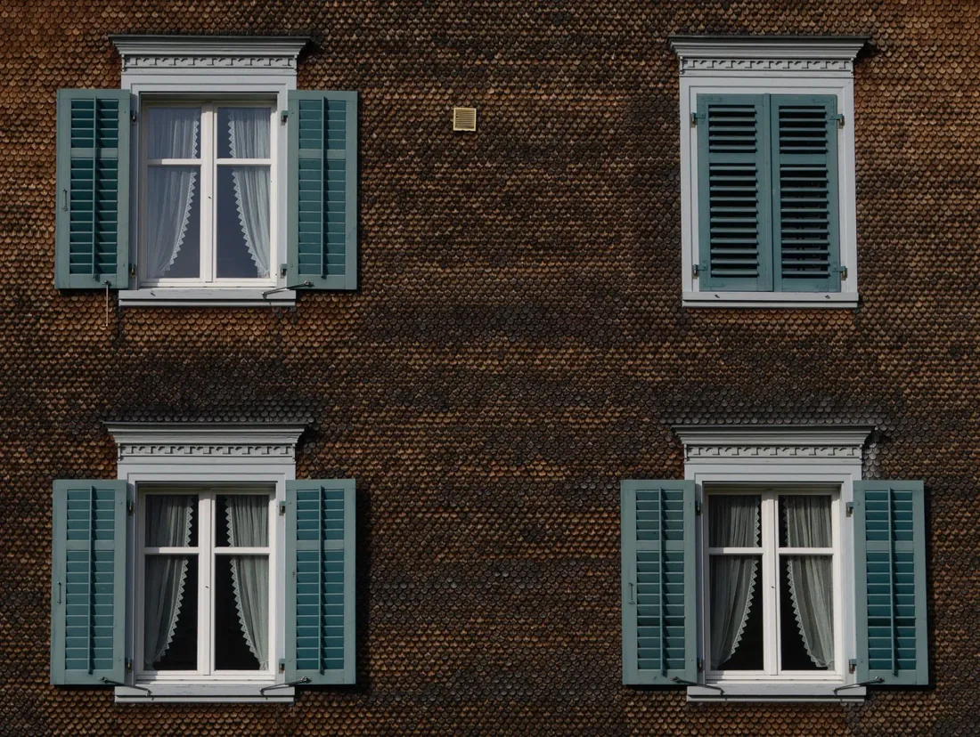 Casement windows with painted shutters