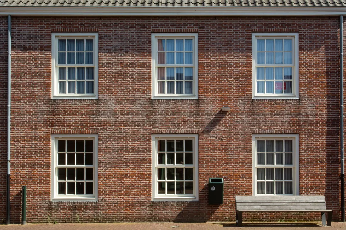White sash windows on a red brick house
